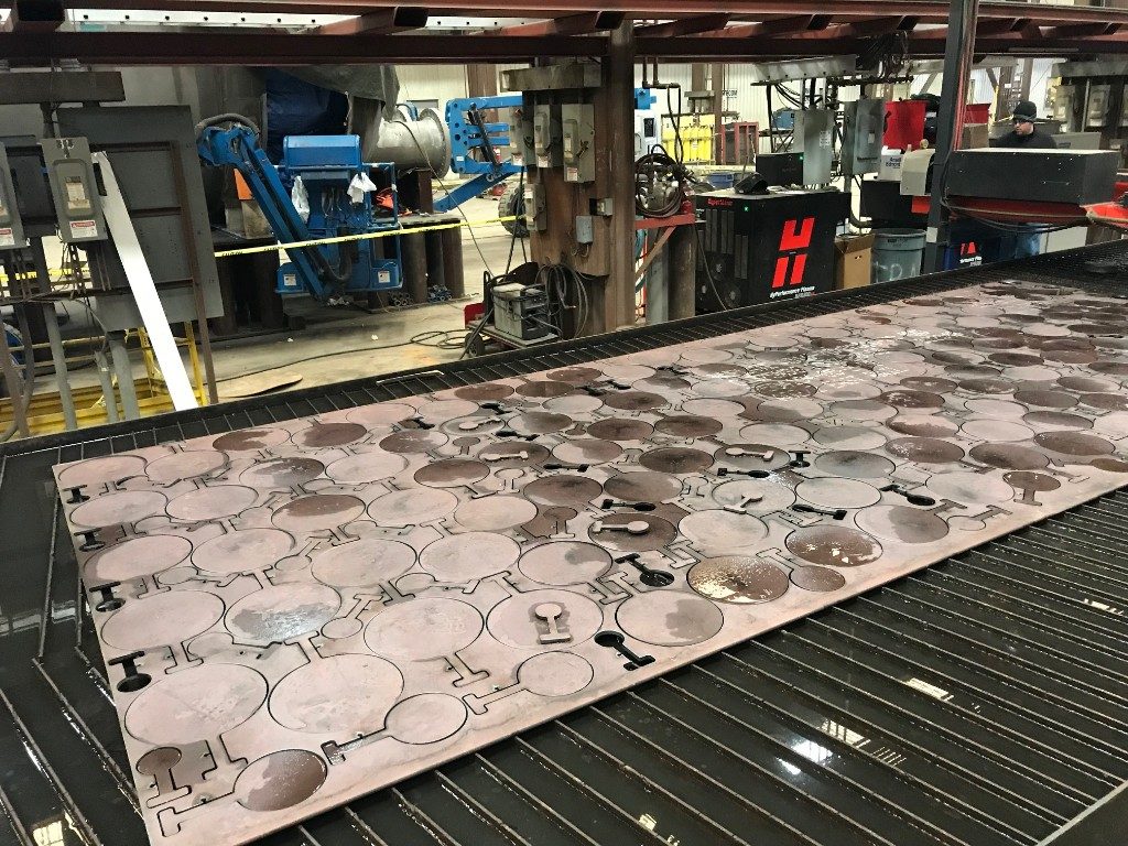 Paddle blinds cut from plate on a burning table