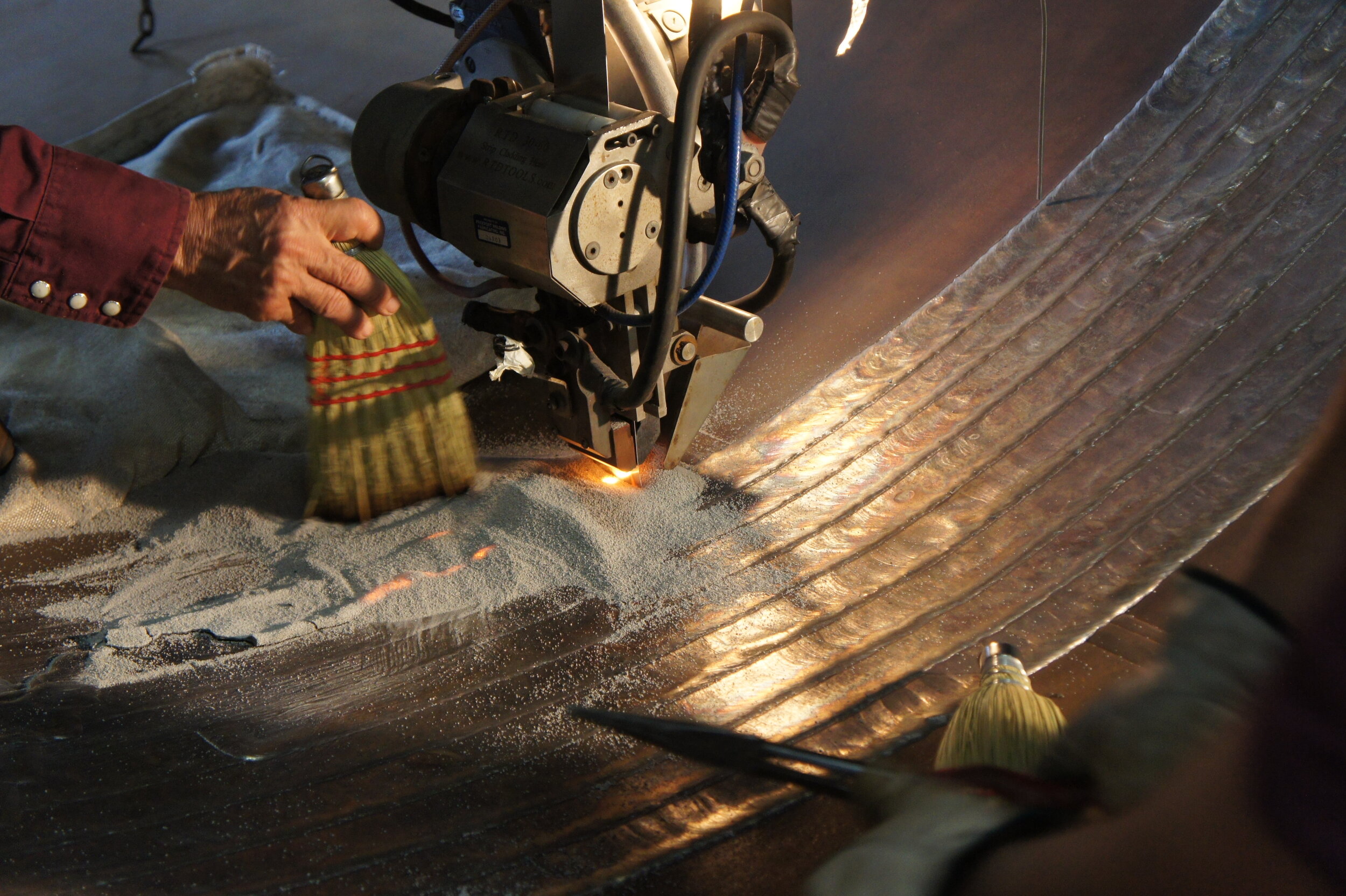 Heavy fabrication machinery and rolling equipment in operation